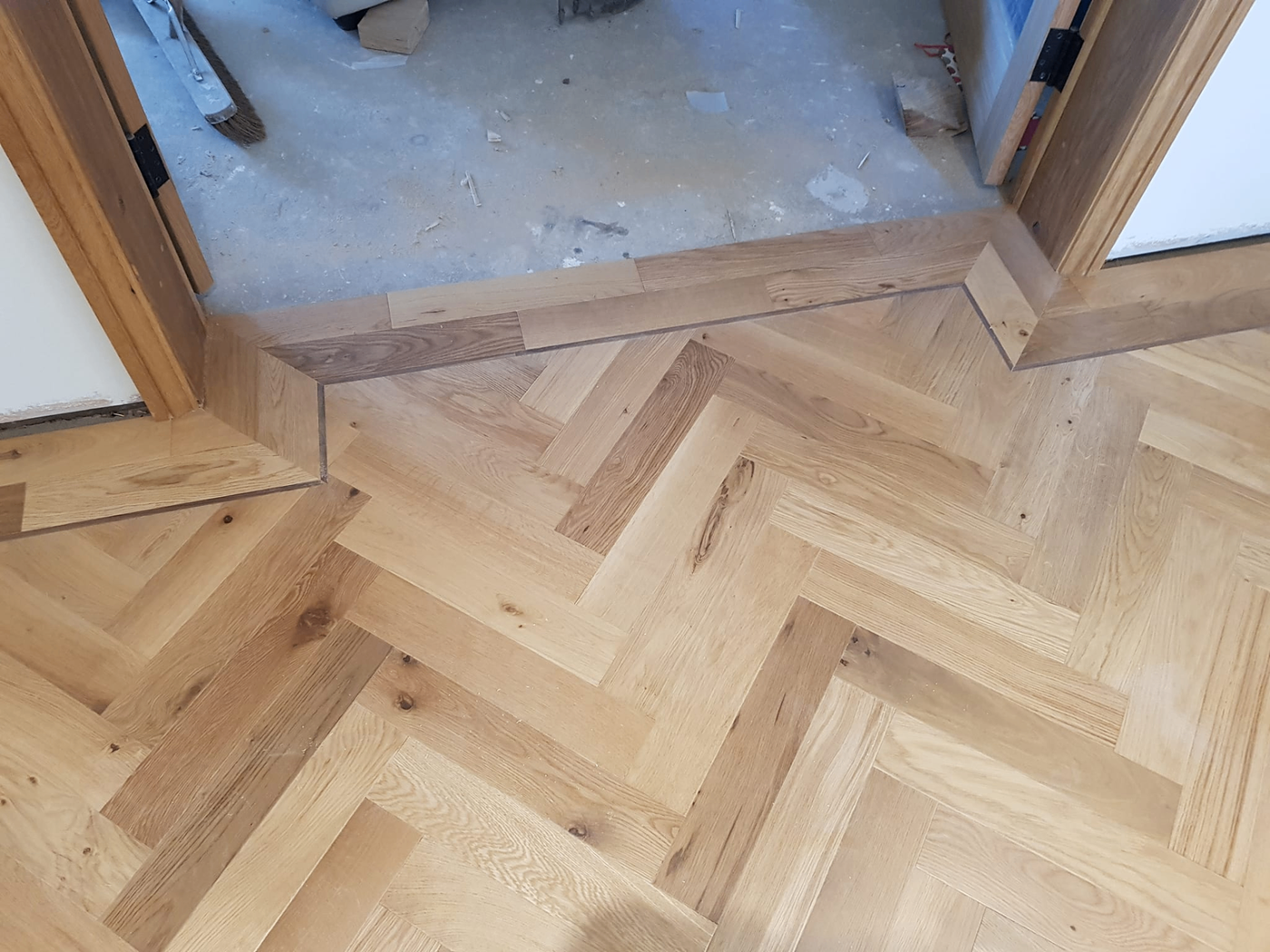 Herringbone flooring threshold and transition detail
