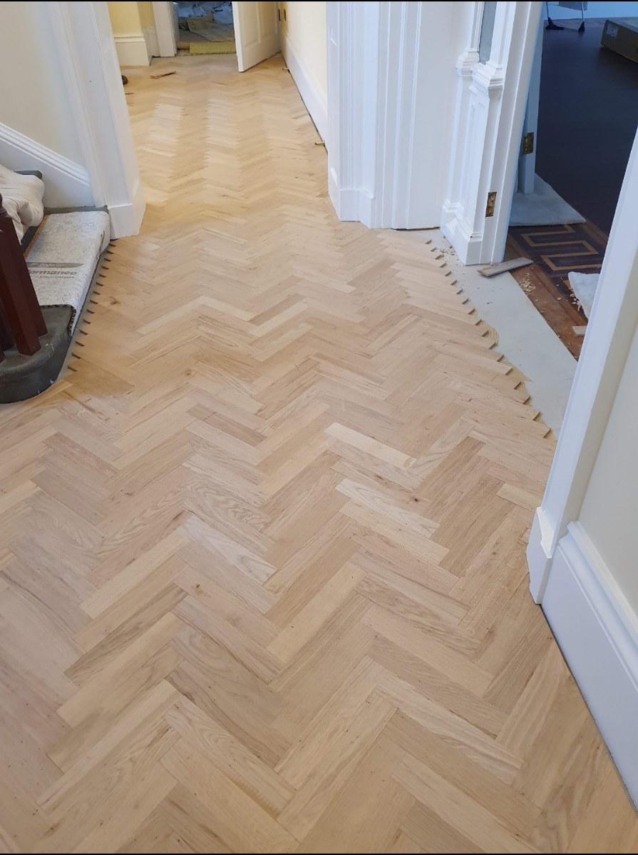 Herringbone flooring installation photo 5
